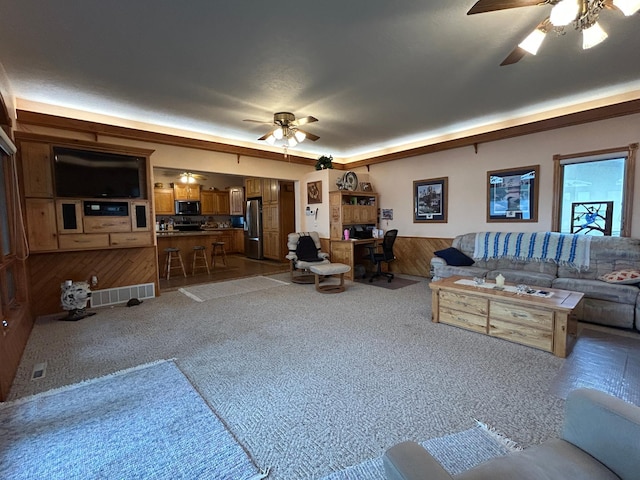 14620 Thomas Rd, Lake Park, MN 56554 - living area featuring ceiling fan, carpet flooring, and wooden walls