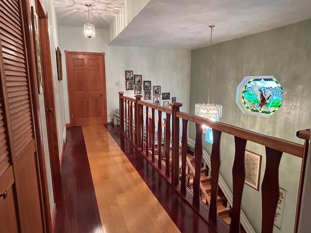 14620 Thomas Rd, Lake Park, MN 56554 - corridor featuring a chandelier and wood-type flooring