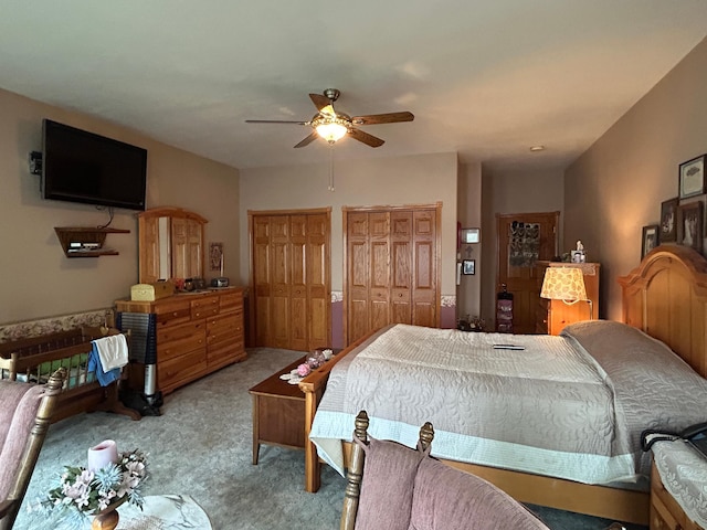 14620 Thomas Rd, Lake Park, MN 56554 - bedroom featuring light carpet, multiple closets, and a ceiling fan