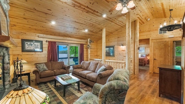 9231 Shady Haven Dr NW, Alexandria, MN 56308 - living room with wooden walls, wooden ceiling, wood finished floors, ceiling fan, and a chandelier