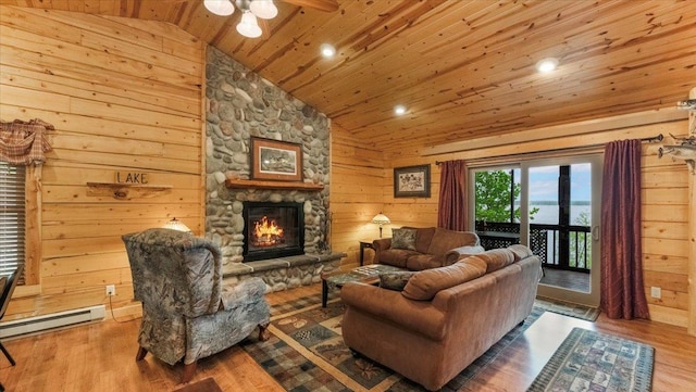 9231 Shady Haven Dr NW, Alexandria, MN 56308 - living room with wood ceiling, a fireplace, a ceiling fan, wood finished floors, and recessed lighting