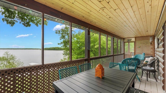 9231 Shady Haven Dr NW, Alexandria, MN 56308 - sunroom featuring outdoor dining area, a water view, and healthy amount of natural light