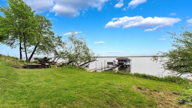 9231 Shady Haven Dr NW, Alexandria, MN 56308 - dock area featuring boat lift, a water view, and a yard