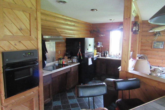 4054 Aspen Rd, Barnum Twp, MN 55767 - kitchen with black appliances, extractor fan, and log walls