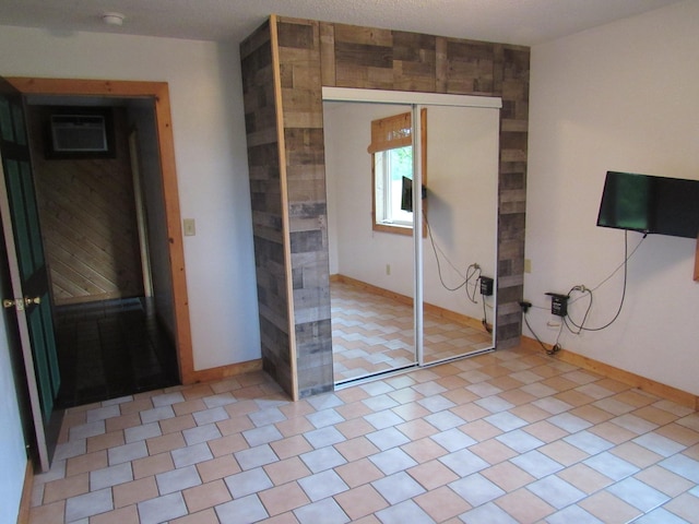 4054 Aspen Rd, Moose Lake, MN 55767 - unfurnished bedroom featuring a closet and a wall mounted AC