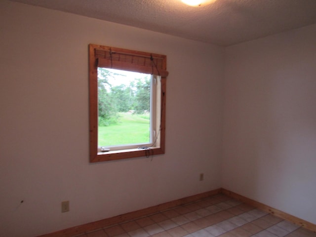 4054 Aspen Rd, Moose Lake, MN 55767 - empty room featuring baseboards and light tile patterned floors