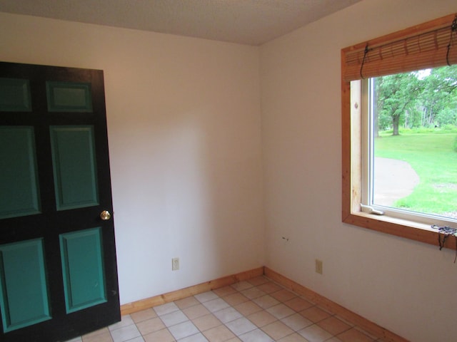4054 Aspen Rd, Moose Lake, MN 55767 - spare room featuring light tile patterned floors and baseboards