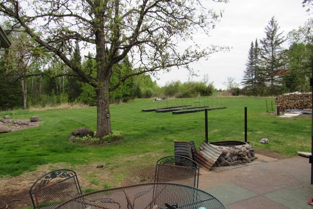 4054 Aspen Rd, Moose Lake, MN 55767 - view of green lawn with a patio area
