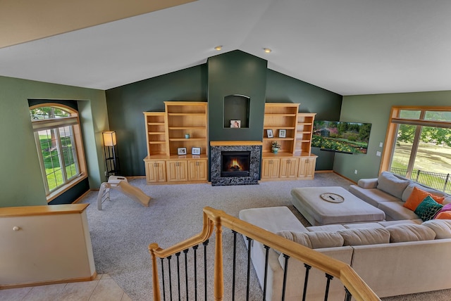23807 Brendan Way, Rogers, MN 55374 - carpeted living room with vaulted ceiling, a glass covered fireplace, and baseboards
