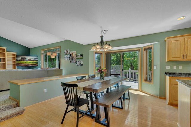 23807 Brendan Way, Rogers, MN 55374 - dining room featuring a chandelier, light wood-style flooring, recessed lighting, baseboards, and vaulted ceiling