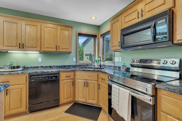 23807 Brendan Way, Rogers, MN 55374 - kitchen with black appliances, a sink, dark stone countertops, recessed lighting, and light wood-style flooring