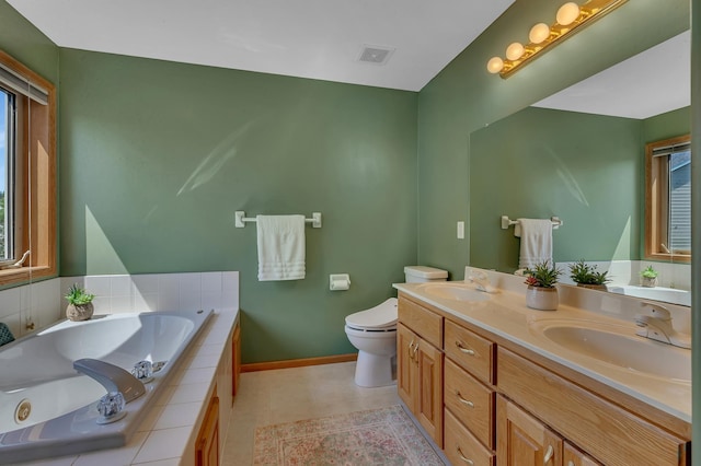 23807 Brendan Way, Rogers, MN 55374 - full bathroom with baseboards, a bath, toilet, and double vanity