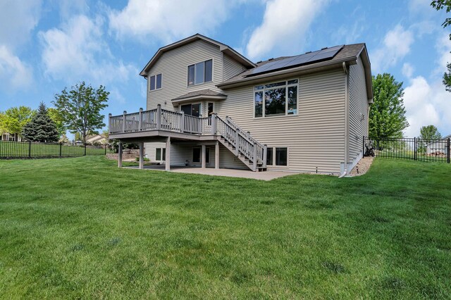 23807 Brendan Way, Rogers, MN 55374 - back of house with a deck, roof mounted solar panels, a patio area, and stairway