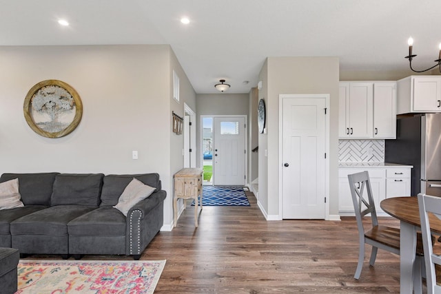 1049 Fabel Ln, Waconia, MN 55387 - living area featuring dark wood finished floors, baseboards, and recessed lighting