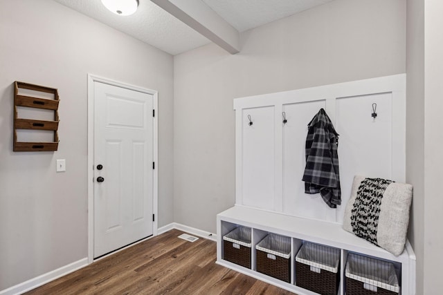 1049 Fabel Ln, Waconia, MN 55387 - mudroom with wood finished floors, baseboards, beam ceiling, and a textured ceiling