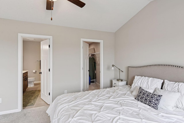 1049 Fabel Ln, Waconia, MN 55387 - bedroom with light colored carpet, a spacious closet, ensuite bathroom, a closet, and lofted ceiling
