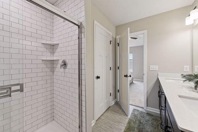 1049 Fabel Ln, Waconia, MN 55387 - bathroom with a shower stall, double vanity, baseboards, and tile patterned floors