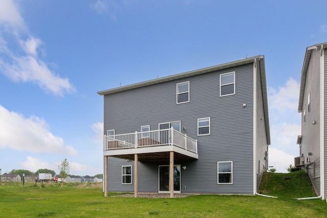 1049 Fabel Ln, Waconia, MN 55387 - back of house featuring a lawn, a wooden deck, and central air condition unit