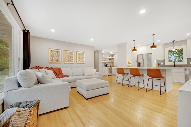 2400 Oakwood Dr, Burnsville, MN 55306 - living room featuring light wood-style floors and recessed lighting