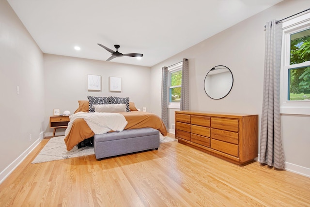2400 Oakwood Dr, Burnsville, MN 55306 - bedroom with light wood finished floors, baseboards, ceiling fan, and recessed lighting