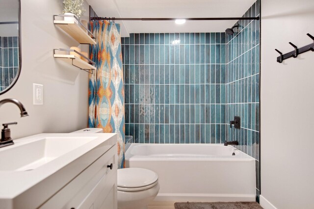 2400 Oakwood Dr, Burnsville, MN 55306 - bathroom featuring shower / bath combination with curtain, toilet, and vanity