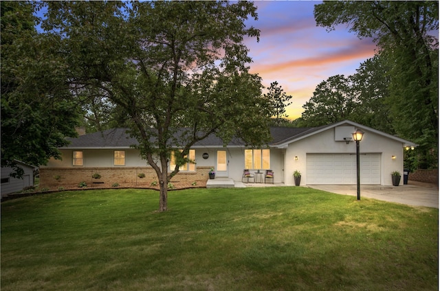 2400 Oakwood Dr, Burnsville, MN 55306 - single story home with driveway, an attached garage, a front lawn, stucco siding, and a porch