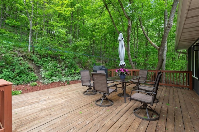 W1618 850th Ave, Spring Valley, WI 54767 - wooden deck featuring outdoor dining space and a wooded view