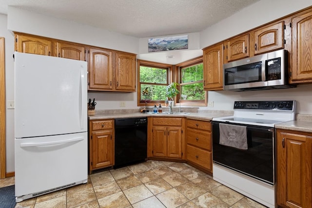 W1618 850th Ave, Spring Valley, WI 54767 - kitchen with freestanding refrigerator, stainless steel microwave, range with electric stovetop, dishwasher, and brown cabinets
