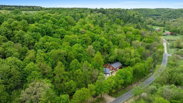 W1618 850th Ave, Spring Valley, WI 54767 - aerial view of property and surrounding area featuring a heavily wooded area