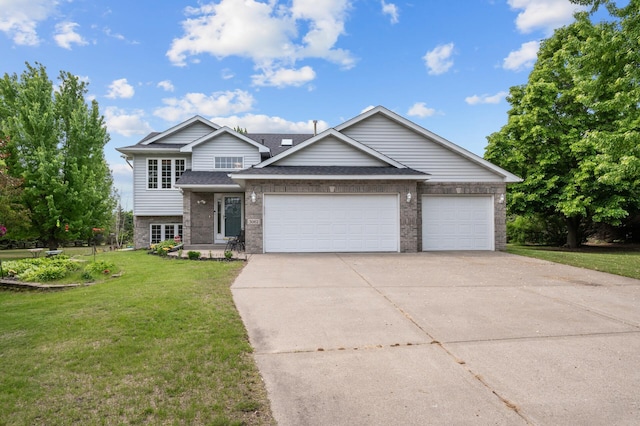 3062 196th Ave NE, East Bethel, MN 55011 - view of front facade with a front lawn, concrete driveway, an attached garage, brick siding, and roof with shingles