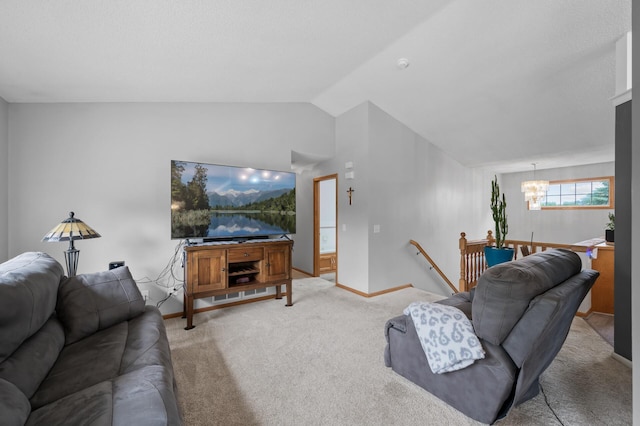 3062 196th Ave NE, East Bethel, MN 55011 - living room featuring a chandelier, vaulted ceiling, light colored carpet, and baseboards