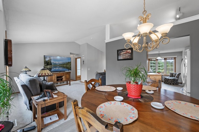 3062 196th Ave NE, East Bethel, MN 55011 - dining space with a chandelier and lofted ceiling
