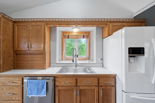 3062 196th Ave NE, East Bethel, MN 55011 - kitchen with white refrigerator with ice dispenser, dishwasher, a sink, brown cabinetry, and light countertops