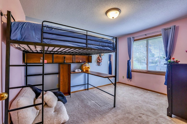 11215 Sumter Ave N, Champlin, MN 55316 - carpeted bedroom with a textured ceiling and baseboards
