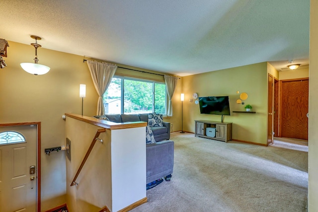 11215 Sumter Ave N, Champlin, MN 55316 - carpeted living room featuring a textured ceiling and baseboards