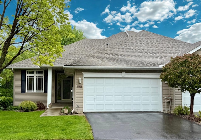 2235 Glacier Way, Hastings, MN 55033 - view of front of home with roof with shingles, a garage, driveway, and a front lawn