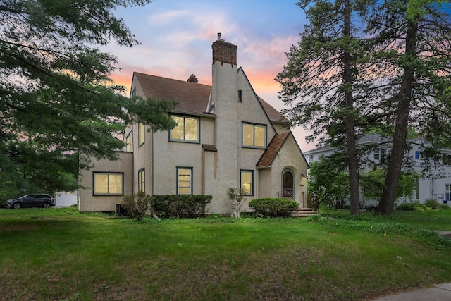 2708 Chowen Ave S, Minneapolis, MN 55416 - tudor home with stucco siding, a chimney, and a front lawn