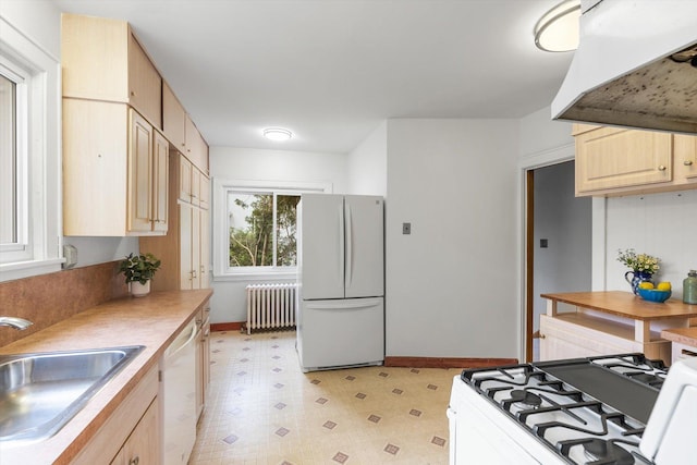 2708 Chowen Ave S, Minneapolis, MN 55416 - kitchen with white appliances, radiator heating unit, a sink, light brown cabinets, and light flooring