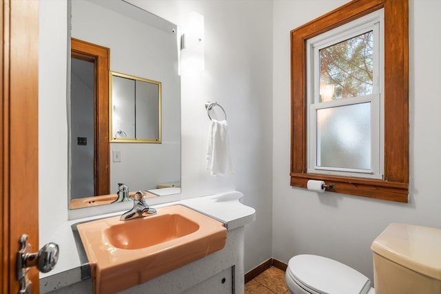 2708 Chowen Ave S, Minneapolis, MN 55416 - bathroom with toilet, baseboards, vanity, and tile patterned flooring