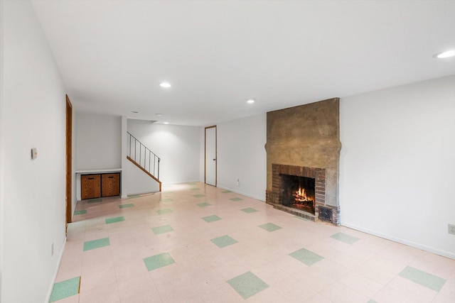 2708 Chowen Ave S, Minneapolis, MN 55416 - unfurnished living room with stairs, recessed lighting, a fireplace, and baseboards