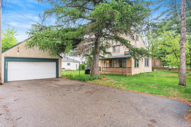 2708 Chowen Ave S, Minneapolis, MN 55416 - view of front facade with a front yard, a detached garage, and stucco siding
