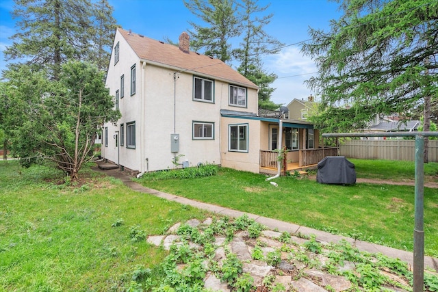 2708 Chowen Ave S, Minneapolis, MN 55416 - rear view of house featuring stucco siding, a chimney, and a deck