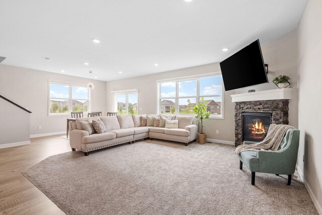 14520 109th Ave N, Maple Grove, MN 55369 - living room featuring healthy amount of natural light, a fireplace, recessed lighting, and light wood-style flooring