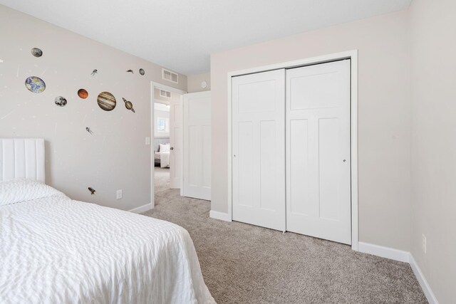 14520 109th Ave N, Maple Grove, MN 55369 - bedroom featuring light colored carpet and a closet
