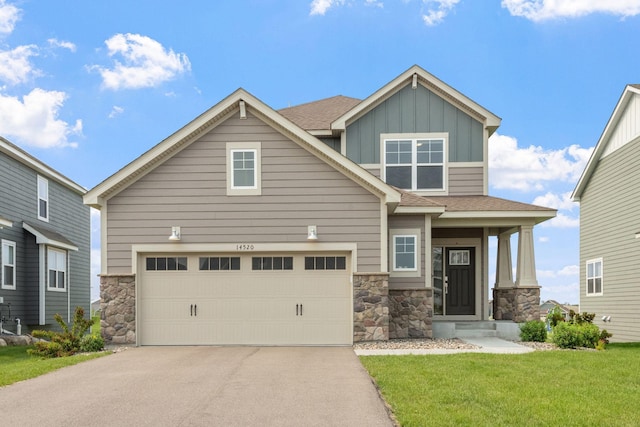 14520 109th Ave N, Maple Grove, MN 55369 - craftsman inspired home featuring stone siding, board and batten siding, driveway, and a front lawn