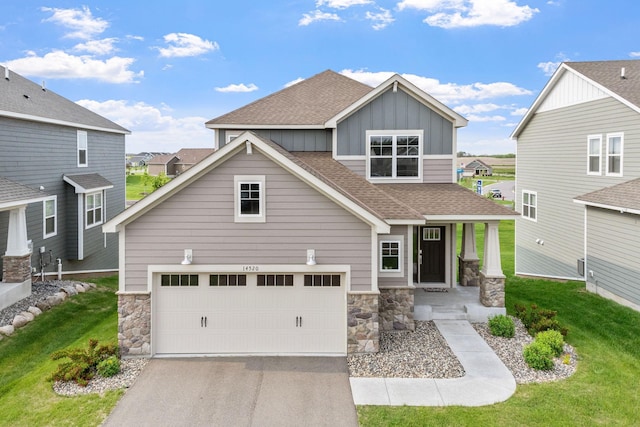 14520 109th Ave N, Maple Grove, MN 55369 - craftsman house with stone siding, board and batten siding, a shingled roof, and a front lawn