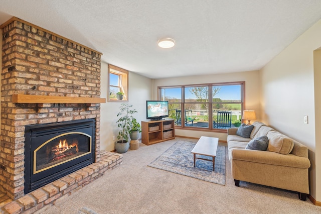 2929 170th St, Frederic, WI 54837 - living room featuring carpet, a brick fireplace, a textured ceiling, and baseboards