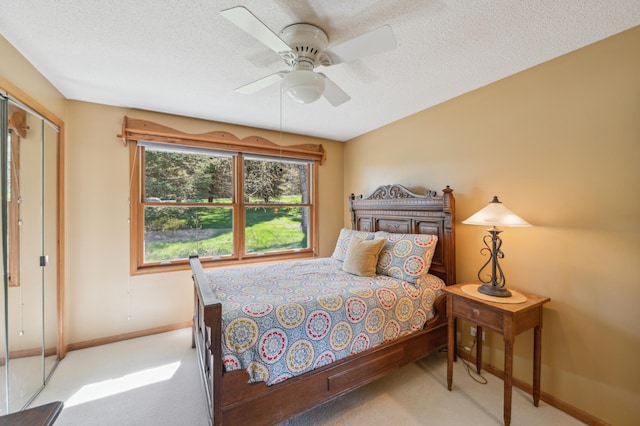 2929 170th St, Frederic, WI 54837 - carpeted bedroom with baseboards, a textured ceiling, ceiling fan, and a closet