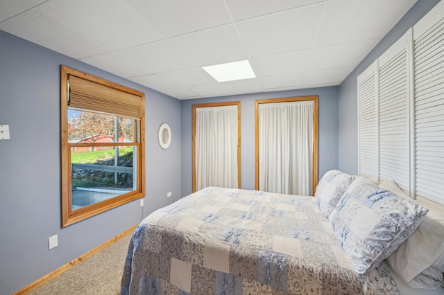 2929 170th St, Frederic, WI 54837 - bedroom featuring carpet floors, baseboards, and a paneled ceiling