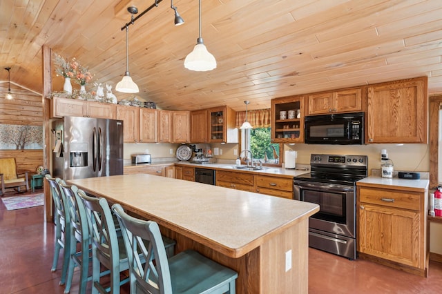 2929 170th St, Frederic, WI 54837 - kitchen with black appliances, wooden ceiling, a sink, vaulted ceiling, and light countertops